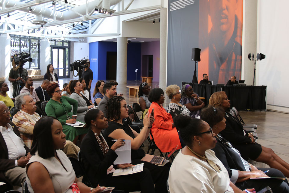 A crowd inside the California African American Museum listens to the poll presentation. A crowd inside the California African American Museum listens to the poll presentation.